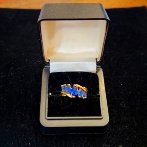 Gold Tone Overlay Twist Ring with 7 Blue Sapphires